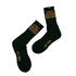 Black socks featuring a logo and text in gold, with a ribbed design and a crew length.