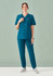 A woman models a teal women's scrub top with a V-neck and matching scrub pants, featuring a logo.