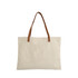 A canvas bag in beige with brown leather straps, featuring a plain design and a logo on the side.