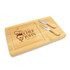 A bamboo cheese board with two metal knives, featuring a logo and a carved area for serving.