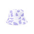 A bucket hat featuring a white base adorned with purple cow print patterns and a striped brim.