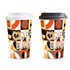 Two paper coffee cups, one white lid and one black lid, featuring a vibrant geometric design in warm colours.