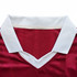 A red jersey featuring a white collar, made from 100% polyester milk silk. It has a logo on the fabric.