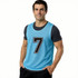 A blue polyester micro mesh training bib featuring the number 7, worn by a man. The bib has a logo.