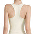 A seamless women's yoga bra tank in cream, featuring wide straps and a racerback design. It has a logo on it.