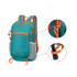 A packable hiking backpack in teal with orange accents, featuring adjustable straps and mesh pockets.
