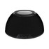 A black wireless charging speaker with a textured surface and control buttons on the front.