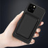 A black magnetic wireless power bank in a person's hand, designed for smartphone charging.