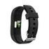 A black smart band with a textured strap, featuring a sensor on the underside and a metallic clasp.