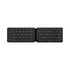 A foldable Bluetooth keyboard in black, featuring a compact design with standard keys and a side logo.