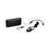 A compact black and silver Bluetooth speaker with a keychain attachment and USB charging cable.