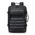 A black backpack with a patterned front panel and multiple pockets. It features adjustable straps and a logo.