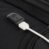 A black backpack featuring a USB charging port, made from durable fabric with a sleek design.
