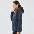 A navy women's thermal jacket with a hood and quilted design, featuring side pockets and a sleek fit.