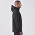 A men's softshell jacket in black, featuring a hood and a logo, displayed on a model from the side.