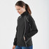 A black women's jacket with white piping, featuring a zip front and high collar, displayed on a model.