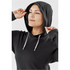 A model wearing a black women's pullover hoody with a hood and drawstrings. The fabric has a textured look.