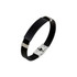 A stylish black bracelet featuring a metal buckle latch and silver accents. Ideal for sleek, modern fashion.