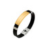A metal buckle latch bracelet featuring a gold-coloured centrepiece and black leather band with silver accents.