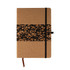 A notebook with a cork cover and a decorative band featuring coffee grounds patterns, secured with a black elastic.