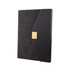 A black notebook with a textured cover and a gold clasp. The design features a unique angled flap and branding.