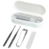 A white manicure set containing a nail clipper, tweezers, and other tools, all housed in a matching case.