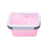 A reusable silicone food storage container in pink with a clear lid and a fork included. Features a logo.