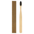 A bamboo toothbrush with a long handle and black bristles, beside a simple brown packaging box.