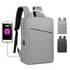 A grey laptop backpack with a front zipper pocket and a charging port, featuring adjustable straps and a minimalist design.
