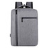 A grey laptop backpack with a main compartment and two front zippered pockets, featuring a handle and padded straps.