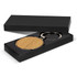 A round wooden key ring displayed in a black gift box, featuring a metal ring and a smooth, natural finish.