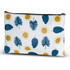 A medium cosmetic bag featuring a pattern of blue leaves and yellow suns on a white background, with a black zipper.
