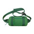 A green travel fanny pack with adjustable straps and a zippered front pocket, featuring a logo.