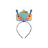 A festive headband featuring a colourful "Cinco de Mayo" design with guitars and a sombrero on top.