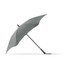 A grey BLUNT Classic Umbrella with a unique, aerodynamic shape and a curved canopy, featuring a logo on the handle.