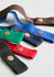 A collection of fabric waist straps in green, red, blue, black, navy, and brown, featuring gold studs and a sturdy design.