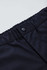 A close-up of black men's comfort waist cargo shorts featuring a button closure and elastic waistband.