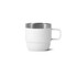 A stackable stainless steel mug in white with a silver rim, featuring a sturdy handle. It has a simple, modern design.
