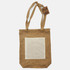 A brown jute tote bag with a cream-coloured pocket and two sturdy handles. It features a tag with a logo.