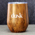 A drink mug with a wood-like finish and a purple lid, featuring a logo on one side.