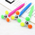 Three fidget pens in pink, blue, and green, featuring spinning tops and vibrant coloured accents. Each has a logo.
