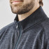 A grey full zip fleece jacket with a stand-up collar, featuring a branding logo and a textured fabric.