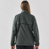 A woman wearing a dark grey full zip rain jacket viewed from the back, featuring a simple design and a logo.