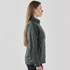A women's full zip jacket in dark green, featuring a fitted design and a logo on the front.