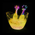 A LED ice bucket in yellow with two bottles surrounded by ice. The bucket features a decorative lighting.