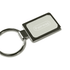 A rectangular silver keychain with a polished finish and a blank insert area for customisation, featuring a metal ring.