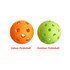 Two pickleballs, one orange for indoor use and one green for outdoor use, featuring multiple holes.