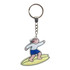 A custom-shaped acrylic keyring featuring a cartoon figure surfing, with a silver keychain and multicoloured design.