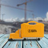 A yellow truck-shaped toolkit with wheels and a handle, set against a construction background.