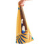 A hand holds a yellow bag with a tropical design containing various bottles inside.